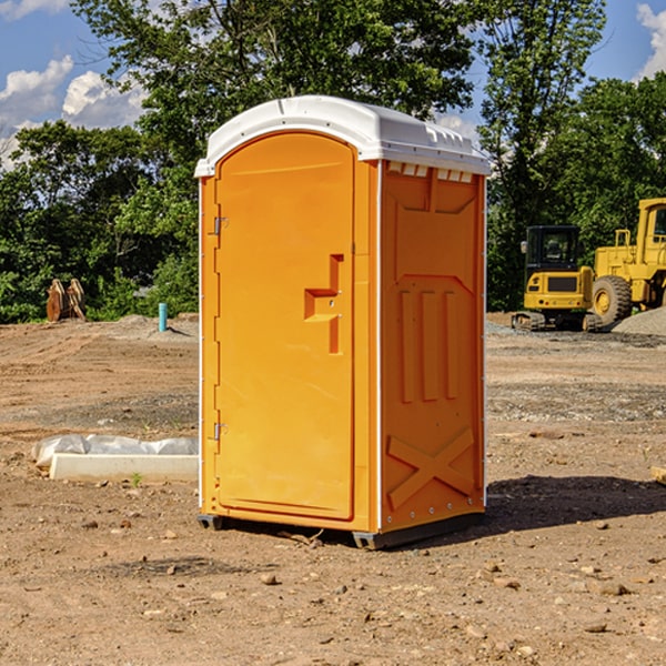 what is the cost difference between standard and deluxe portable restroom rentals in Lane